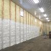 Spray foam insulation being painted white